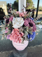 Sola wood floral arrangement in striped vase