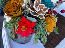 Large Christmas holiday arrangement in metal container with Red Truck