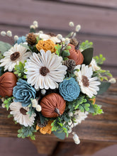 Sola wood floral arrangement in metal tin