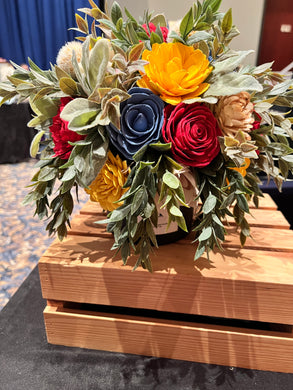 Sola Wood Flower arrangement arranged on lid of candle