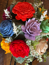 Sola wood flowers in metal wheel barrow
