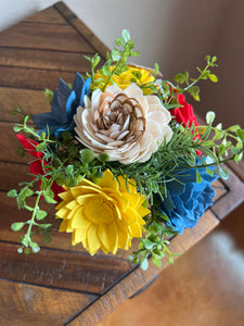 Sola wood flowers in small metal milk jug