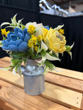 Sola wood flowers in small metal milk jug