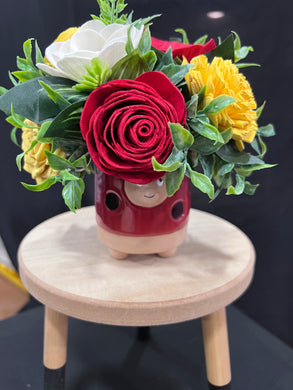 Sola wood flowers in a lady bug container