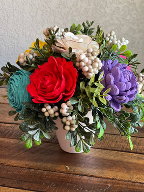 Sola Wood floral arrangement in terra cotta pot