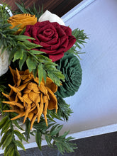 Sola Wood flower arrangement in container with trees on it.