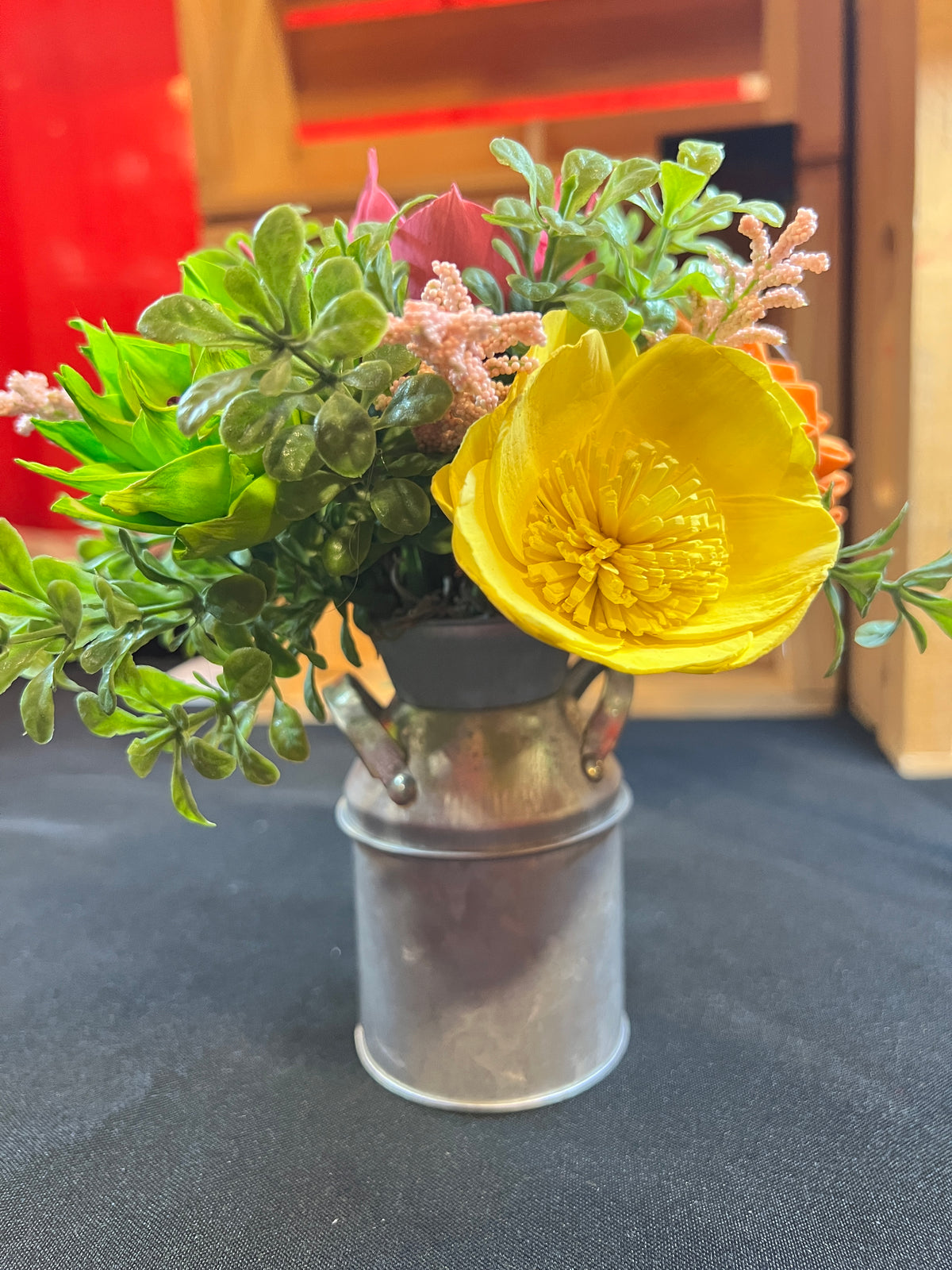 Sola wood flowers in small metal milk jug