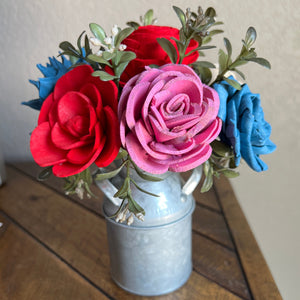 Sola wood flowers in small metal milk jug