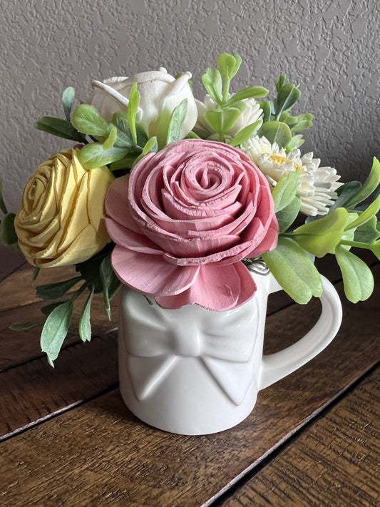 Sola wood flowers in small white ceramic cup with bow