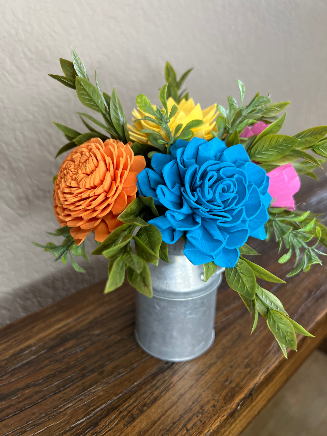 Sola wood flowers in small metal milk jug