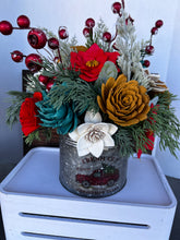 Large Christmas holiday arrangement in metal container with Red Truck