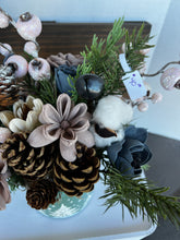 Sola Wood Flower arrangement in green holiday container.