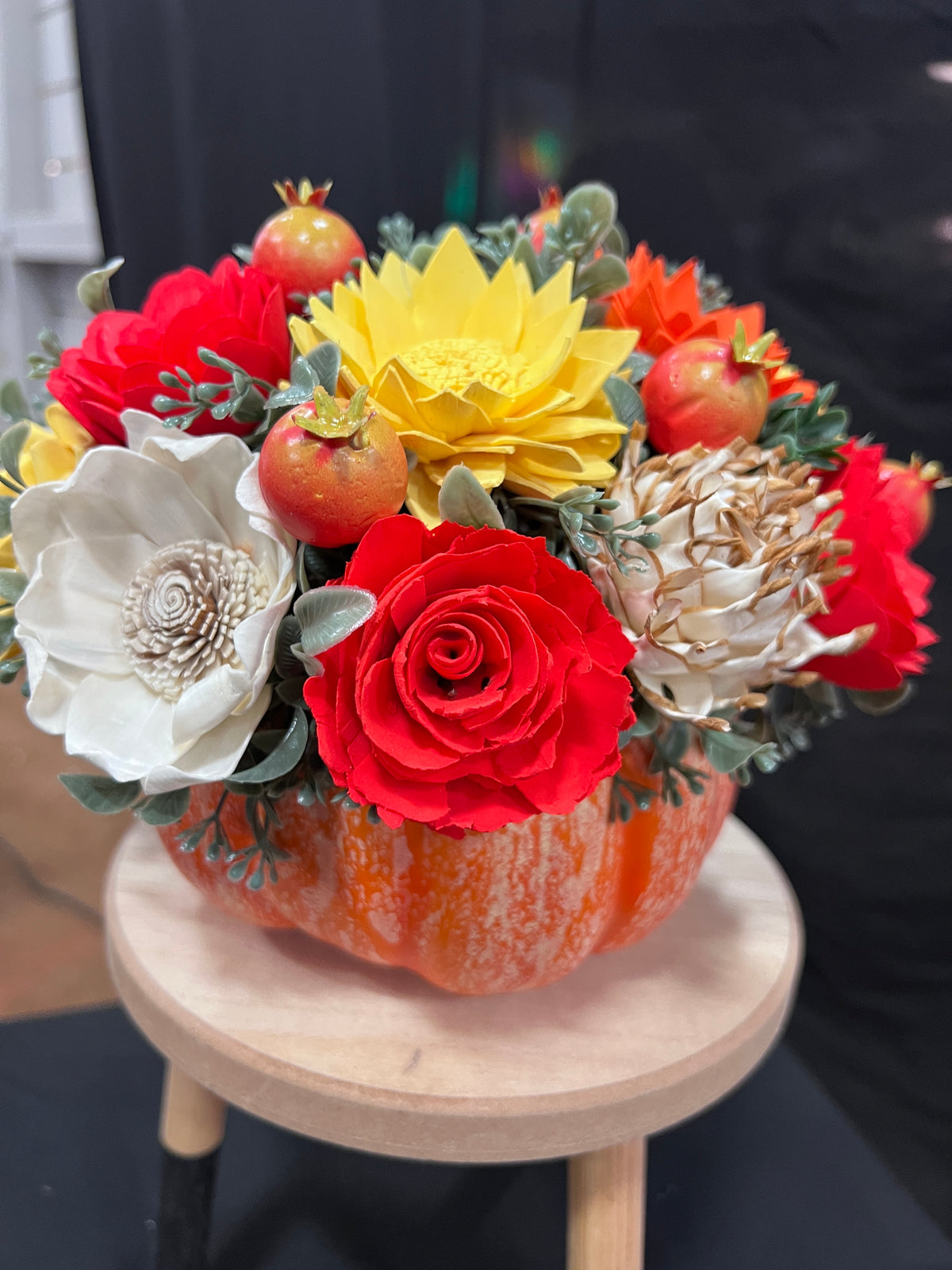 Fall Sola wood floral arrangement on pumpkin