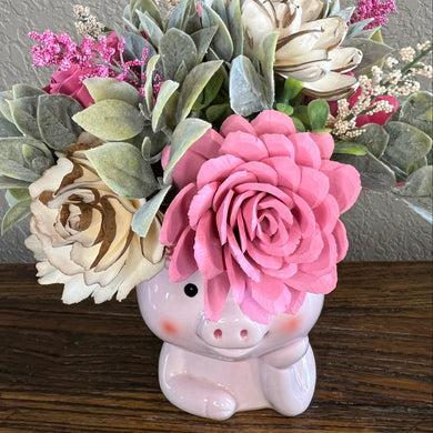 Sola wood floral arrangement in ceramic pink pig