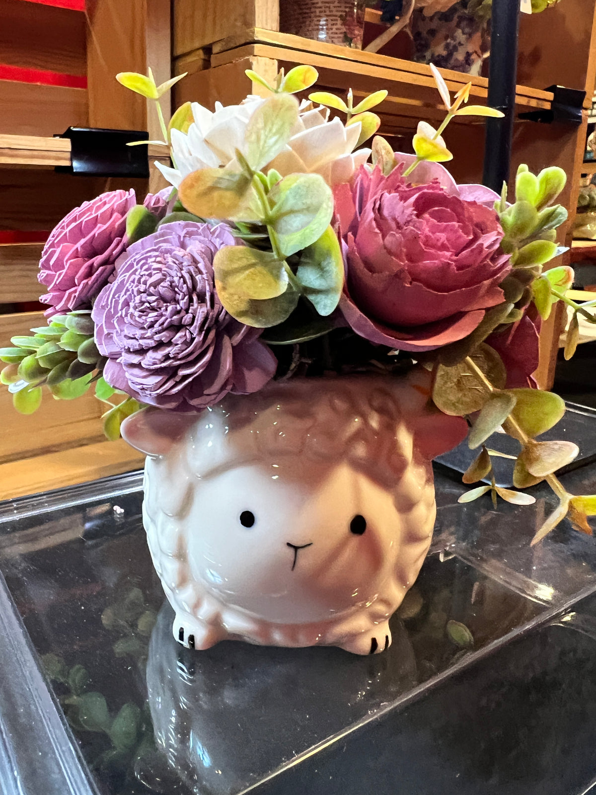 Sola wood flowers in a sheep ceramic container