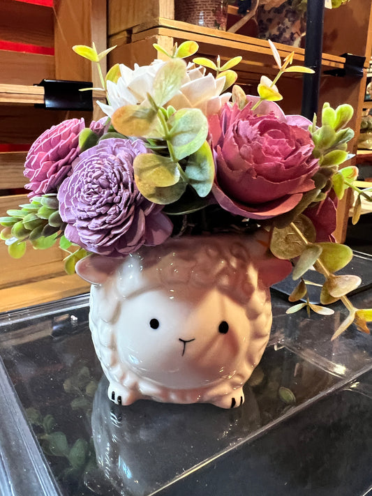 Sola wood flowers in a sheep ceramic container