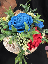 Sola wood flowers in a lady bug container