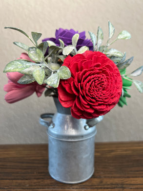 Sola wood flowers in small metal milk jug