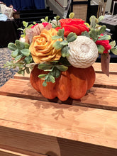 Sola wood flowers on faux pumpkin