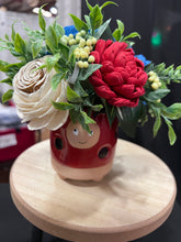 Sola wood flowers in a lady bug container