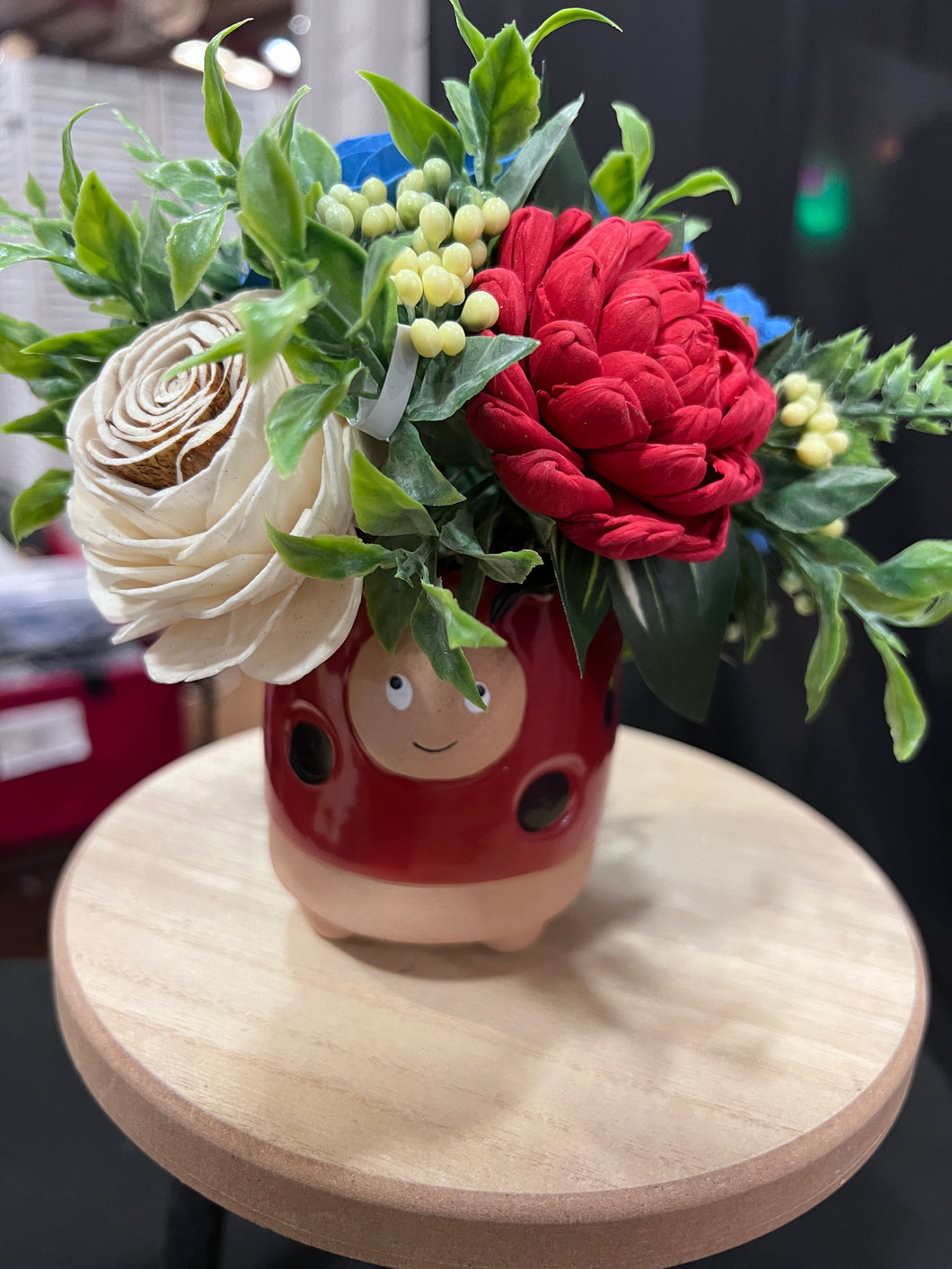Sola wood flowers in a lady bug container