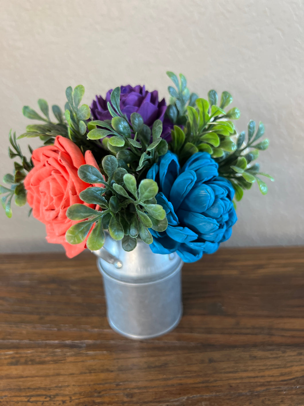 Sola wood flowers in small metal milk jug