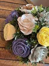 Sola Wood floral arrangement in terra cotta pot