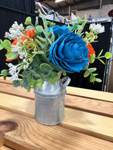 Sola wood flowers in small metal milk jug