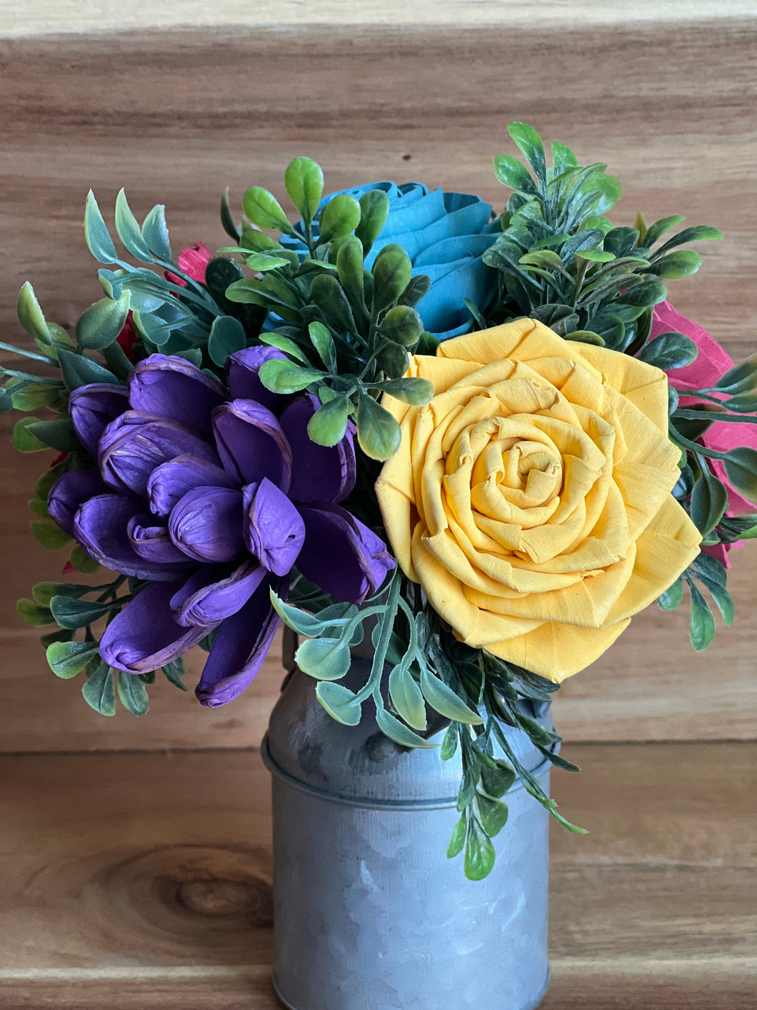 Sola wood flowers in small metal milk jug