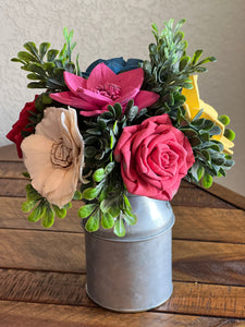 Sola wood flowers in small metal milk jug