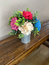 Sola wood flowers in small metal milk jug