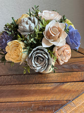 Sola Wood floral arrangement in terra cotta pot
