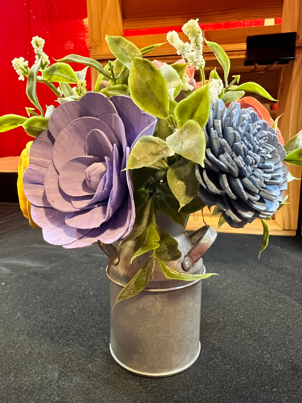 Sola wood flowers in small metal milk jug