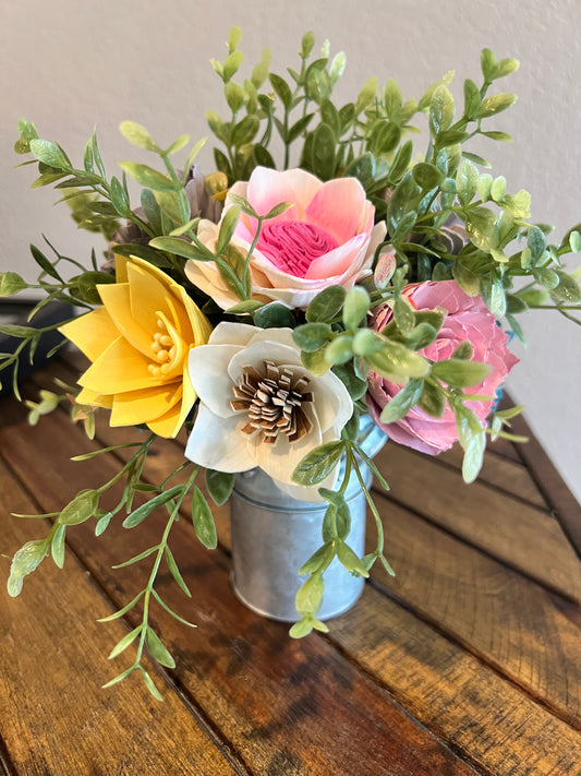 Sola wood flowers in small metal milk jug