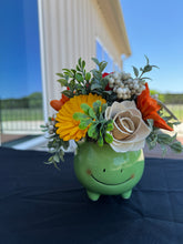 Sola wood flowers in green frog container
