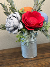 Sola wood flowers in small metal milk jug