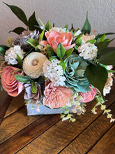 Sola wood floral arrangement in metal tin