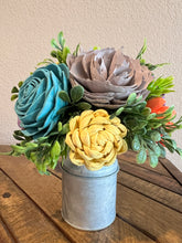 Sola wood flowers in small metal milk jug