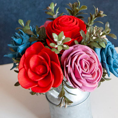 Sola wood flowers in small metal milk jug