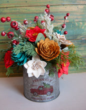 Large Christmas holiday arrangement in metal container with Red Truck