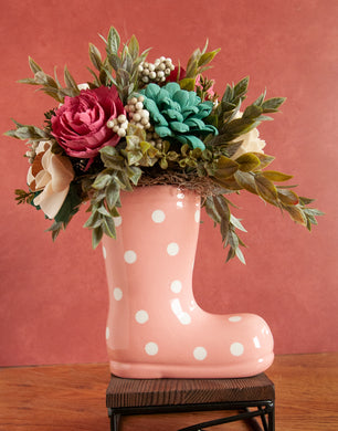 Sola wood floral arrangement in a pink ceramic rain boot