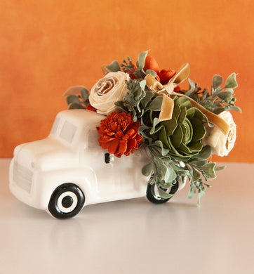 Sola Wood flowers in ceramic truck