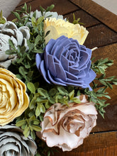 Sola Wood floral arrangement in terra cotta pot