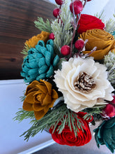 Large Christmas holiday arrangement in metal container with Red Truck