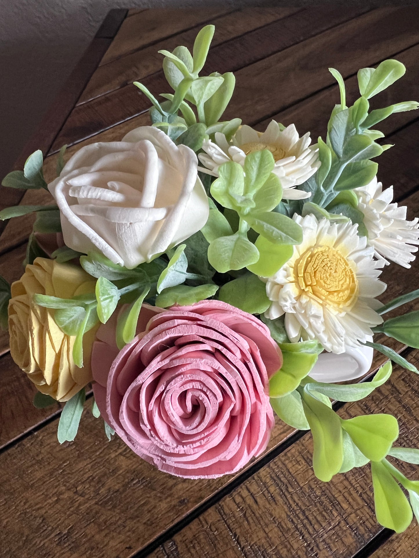 Sola wood flowers in small white ceramic cup with bow