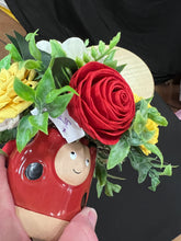 Sola wood flowers in a lady bug container