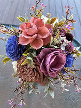 Sola wood floral arrangement in striped vase