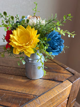 Sola wood flowers in small metal milk jug