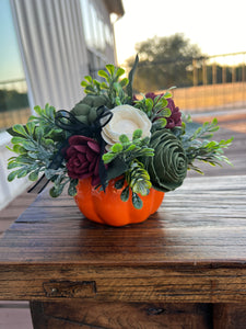 Sola wood flower arrangement in orange ceramic pumpkin