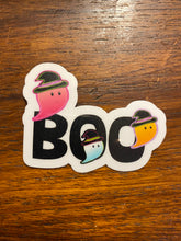 Three colorful ghosts hovering around the word "BOO"!